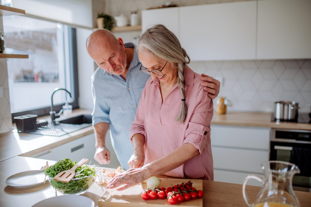 Happy,Senior,Couple,Cooking,Together,At,Home.
